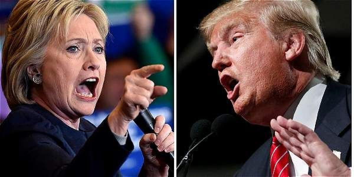 Clinton y Trump en su versión de títeres, en la antesala del debate que se cumplió anoche entre los dos aspirantes presidenciales.