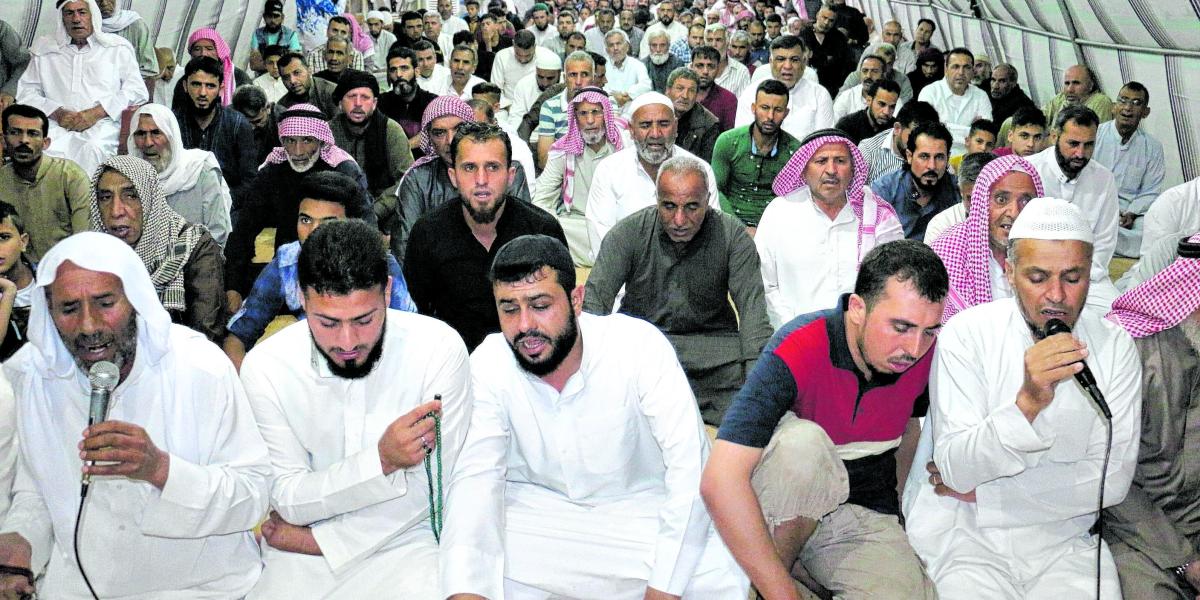 Sirios musulmanes refugiados en Turquía durante la celebración de Eid al-Fitr, en el campo de Harran.