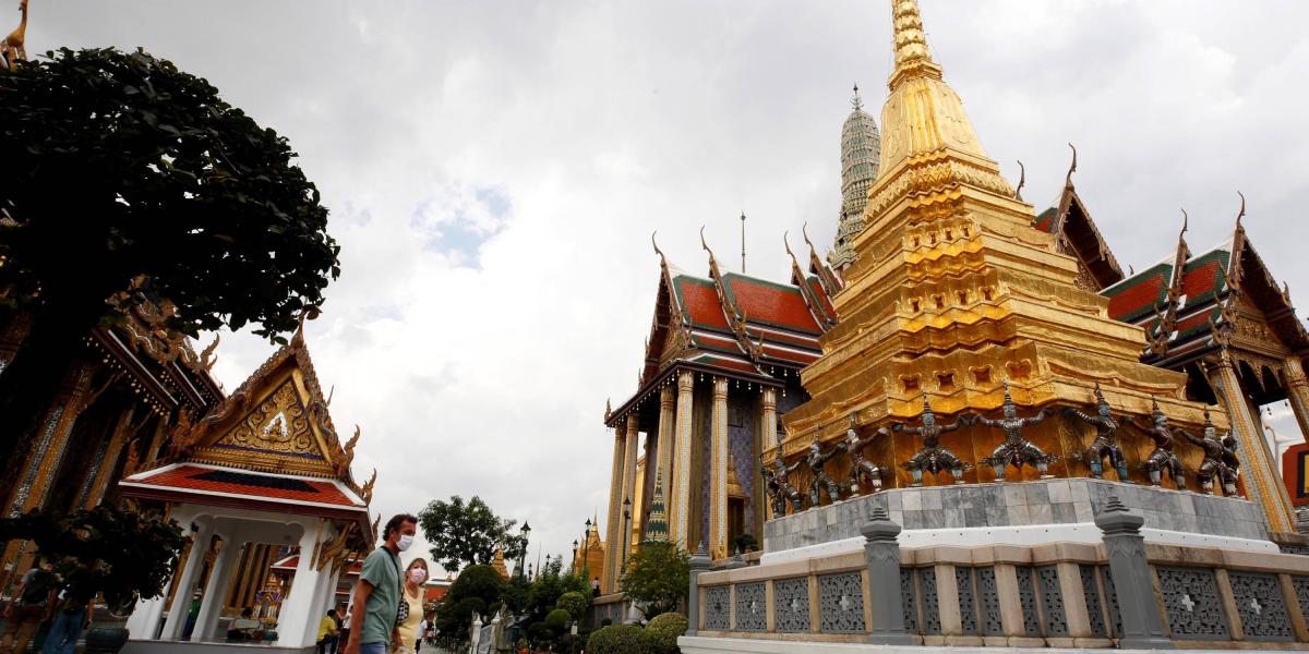 Foreign tourists visit the Emerald Buddha Temple during the first day of the country's reopening for foreign visitors in Bangkok, Thailand, 01 November 2021.