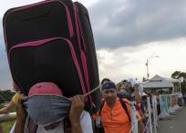 People cross the Simon Bolivar International Bridge on the border between Tachira in Venezuela and Cucuta in Colombia