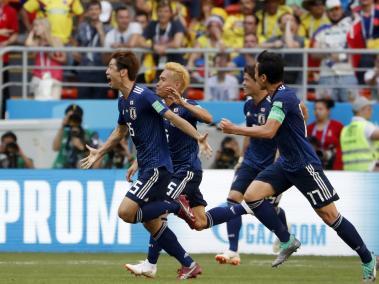 Jugadores de Japón celebraron este domingo.