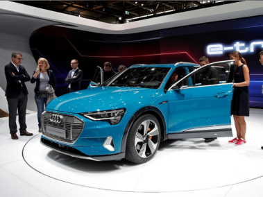People inspect the Audi E-Tron 5S Quattro during the first press day at the Paris auto show, Paris, France, October 2, 2018. REUTERS/Benoit Tessier/File Photo