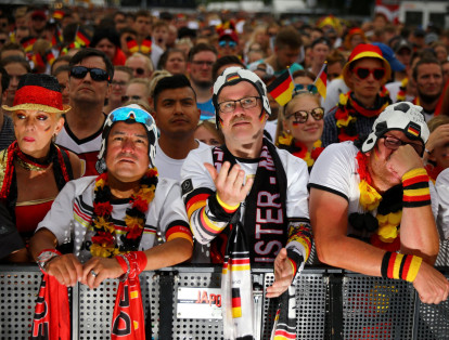 Germany fans react as they watch the match at a public viewing area at Brandenburg Gate.