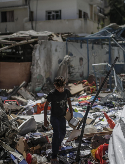 Al Nusairat Refugee Camp (---), 12/09/2024.- An internally displaced Palestinian boy inspects the rubble at the UNRWA-run school-turned-shelter of al-Jaouni, a day after the structure was hit by an Israeli airstrike, in Al-Nusairat refugee camp, central Gaza Strip, 12 September 2024. According to the Palestinian Ministry of Health in Gaza, at least 18 Palestinians were killed and dozens were injured in the strike. The United Nations agency for Palestine refugees (UNRWA) said at least six of their workers were among the victims. The Israeli military stated that it conducted a 'precise strike' on militants operating inside a Hamas command and control center in the area of Nuseirat in central Gaza. More than 41,000 Palestinians and over 1,400 Israelis have been killed, according to the Palestinian Health Ministry and the Israel Defense Forces (IDF), since Hamas militants launched an attack against Israel from the Gaza Strip on 07 October 2023, and the Israeli operations in Gaza and the West Bank which followed it. EFE/EPA/MOHAMMED SABER