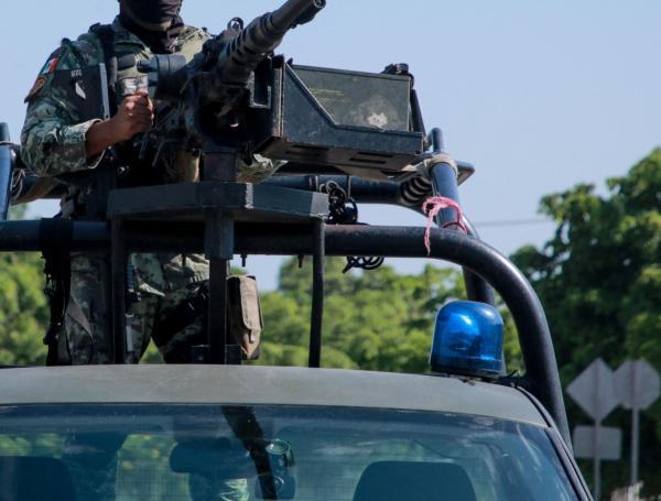Military patrol on the streets of Culiacan, Sinaloa State, Mexico, on September 11, 2024. Elements of Mexico's National Guard were deployed in the state of Sinaloa, in the northwest of the country, amid an escalation of violence that authorities attribute to internal struggles within the Sinaloa cartel following the capture of its leader, Ismael "Mayo" Zambada. (Photo by Ivan MEDINA / AFP)