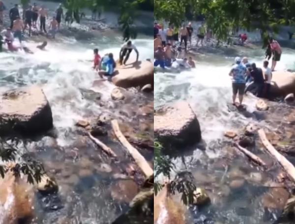 Captura de video que registró el momento en que rescataban a la joven de las aguas del río Manso.