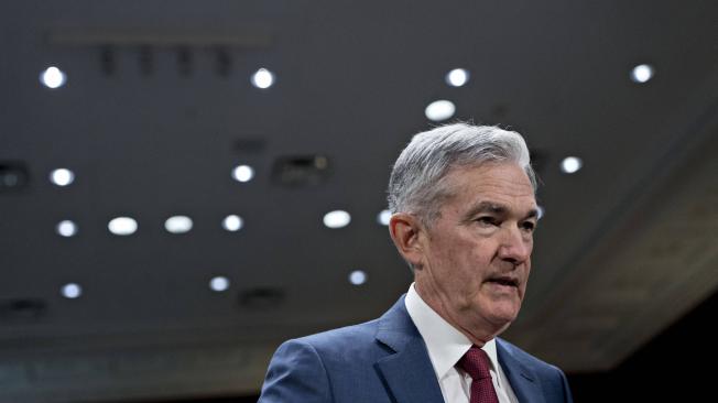Jerome Powell, chairman of the U.S. Federal Reserve, arrives to a Senate Banking Committee hearing in Washington, D.C., U.S., on Thursday, July 11, 2019. Powell said yesterday that downside risks to the economy remain with trade wars softening business investment and weak inflation, signaling that policy makers may be poised to cut interest rates as soon as this month. Photographer: Andrew Harrer/Bloomberg