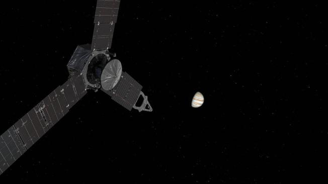 Ilustración de la nave espacial Juno acercándose a Júpiter.