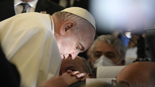 A handout picture provided by the Vatican Media shows Pope Francis praying aboard the plane on his way to Malta International Airport, ahead of his apostolic visit in Luqa, Malta, 02 April 2022. Pope Francis departs for a two-day trip to Malta. (Papa)
