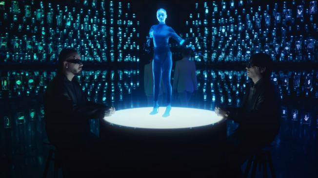 En el video aparecen J Balvin y Chencho "en espacios futuristas y laboratorios" donde son examinados.