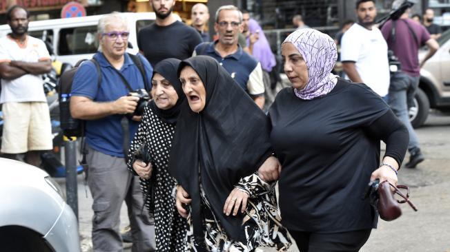 Beirut (Lebanon), 17/09/2024.- Friends and relatives of injured people arrive at the American University of Beirut Medical Center (AUBMC) after an incident involving Hezbollah members' wireless devices in Beirut, Lebanon, 17 September 2024. According to the Lebanese Health minister, at least eight people died and more than 2.500 were injured. 'Several wireless communication devices (pagers) were detonated using advanced technology'Äô, the state news agency said. (Líbano, Hizbulá/Hezbolá) EFE/EPA/WAEL HAMZEH