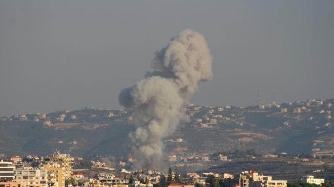 Smoke billows after an Israeli airstrike that targeted the southern Lebanese village of Abbasiyeh on September 24, 2024. Israel announced dozens of new air strikes on Hezbollah strongholds in Lebanon, a day after 558 people, including 50 children, were killed in the deadliest day of violence since the Lebanese civil war. (Photo by Kawnat HAJU / AFP)