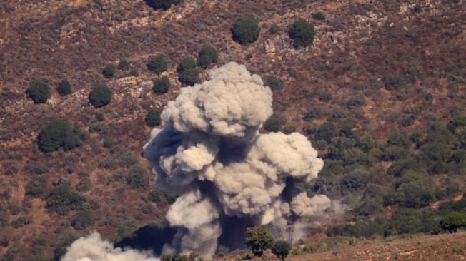 Smoke billows after an Israeli strike near the southern Lebanese village of Al-Mahmoudiye on September 24, 2024. Israel announced dozens of new air strikes on Hezbollah strongholds in Lebanon on September 24, a day after 492 people, including 35 children, were killed in the deadliest bombardment since a devastating war in 2006. (Photo by RABIH DAHER / AFP)