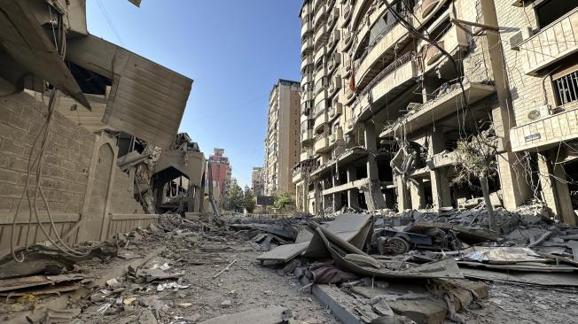 Beirut (Lebanon), 08/10/2024.- A view of the damaged Sayyed Al Shuhada complex (L) following an Israeli strike at Dahieh district in Beirut, Lebanon, 08 October 2024. According to the Lebanese Minister of Health, more than 2,000 people have been killed and more than 9,600 others have been injured in Lebanon since the beginning of the Israeli-Hezbollah conflict. (Líbano, Hizbulá/Hezbolá) EFE/EPA/WAEL HAMZEH