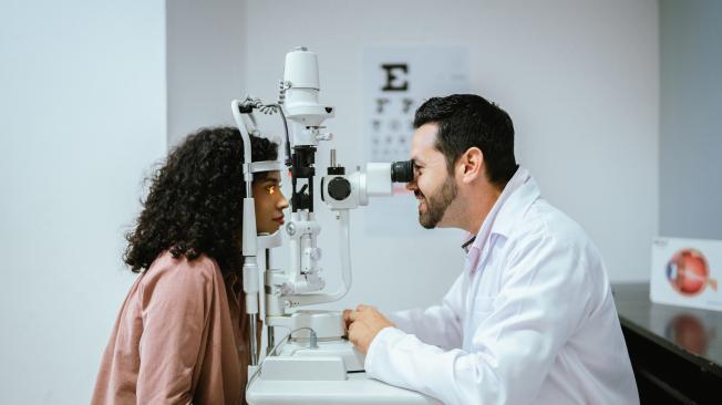 Young woman doing optical exam at medical clinic