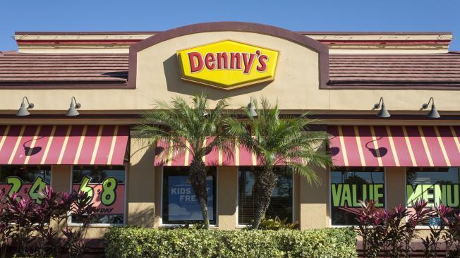  A Denny's restaurant in Orlando, Florida -- various meal specials and advertisements are on display in the windows"