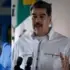 La l??der opositora Mar??a Corina Machado y el presidente de Venezuela, Nicol??s Maduro.