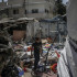 Al Nusairat Refugee Camp (---), 12/09/2024.- An internally displaced Palestinian boy inspects the rubble at the UNRWA-run school-turned-shelter of al-Jaouni, a day after the structure was hit by an Israeli airstrike, in Al-Nusairat refugee camp, central Gaza Strip, 12 September 2024. According to the Palestinian Ministry of Health in Gaza, at least 18 Palestinians were killed and dozens were injured in the strike. The United Nations agency for Palestine refugees (UNRWA) said at least six of their workers were among the victims. The Israeli military stated that it conducted a 'precise strike' on militants operating inside a Hamas command and control center in the area of Nuseirat in central Gaza. More than 41,000 Palestinians and over 1,400 Israelis have been killed, according to the Palestinian Health Ministry and the Israel Defense Forces (IDF), since Hamas militants launched an attack against Israel from the Gaza Strip on 07 October 2023, and the Israeli operations in Gaza and the West Bank which followed it. EFE/EPA/MOHAMMED SABER