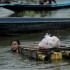 Loikaw (Myanmar), 18/09/2024.- A girl carries the food on the makeshift raft as she wades through the flood at the Phayarni village near Loikaw township, Kayah (Karenni) State, Myanmar, 18 September 2024. At least 226 people died and 77 others are still missing due to the flooding in Myanmar, according State media. Heavy rains triggered by Typhoon Yagi have caused severe flooding across parts of Myanmar, affecting approximately 631,000 people in 59 townships across nine regions and states, including Naypitaw, according to a report by the United Nations Office for the Coordination of Humanitarian Affairs (OCHA) on 16 September 2024. (Inundaciones, Birmania) EFE/EPA/MIN HTET SAN