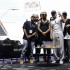 Los cantantes colombianos Maluma (c-i) y Blessd (c-d) posan en la presentación de su nuevo albúm "1 Of 1".