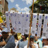 Un ciudadano sostiene reproducciones de actas electorales en una manifestación este sábado, en Caracas (Venezuela).