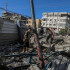 Nuseirat Camp (-), 11/09/2024.- Palestinians search for missing people under the rubble of a destroyed UNRWA-run school, a school-turned-shelter known as al-Jaouni, following an Israeli air strike in Al-Nuseirat refugee camp, central Gaza Strip, 11 September 2024. According to the Palestinian Ministry of Health in Gaza, at least 18 Palestinians have been killed and dozens injured following Israeli air strikes. The Israeli military stated that it conducted a 'precise strike' on militants operating inside a Hamas command and control center in the area of Nuseirat in central Gaza. More than 40,000 Palestinians and over 1,400 Israelis have been killed, according to the Palestinian Health Ministry and the Israel Defense Forces (IDF), since Hamas militants launched an attack against Israel from the Gaza Strip on 07 October 2023, and the Israeli operations in Gaza and the West Bank which followed it. EFE/EPA/MOHAMMED SABER