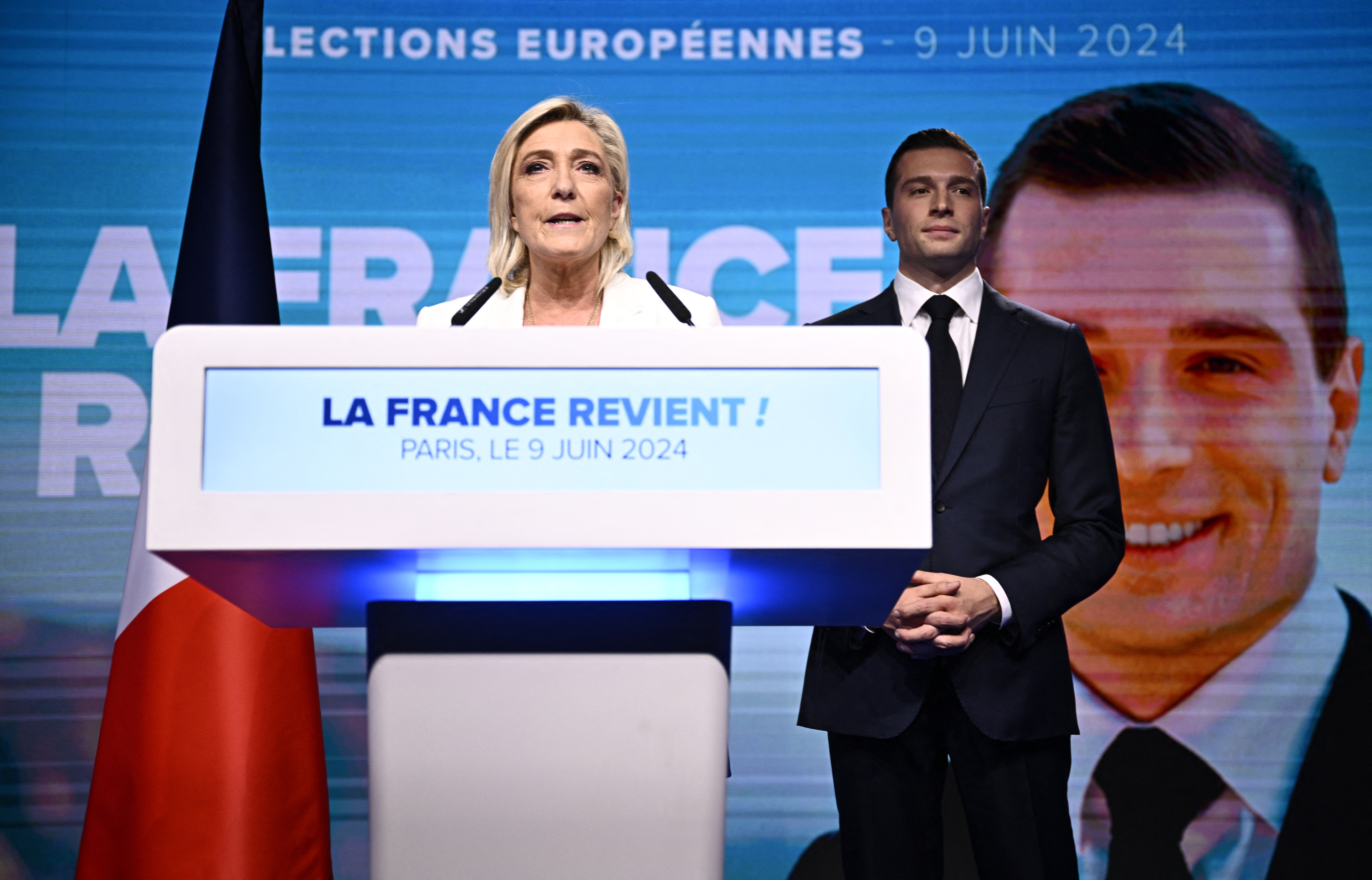 The leader of the French Rassemblement National (RN) party, Marine Le Pen (i), addresses the militants.