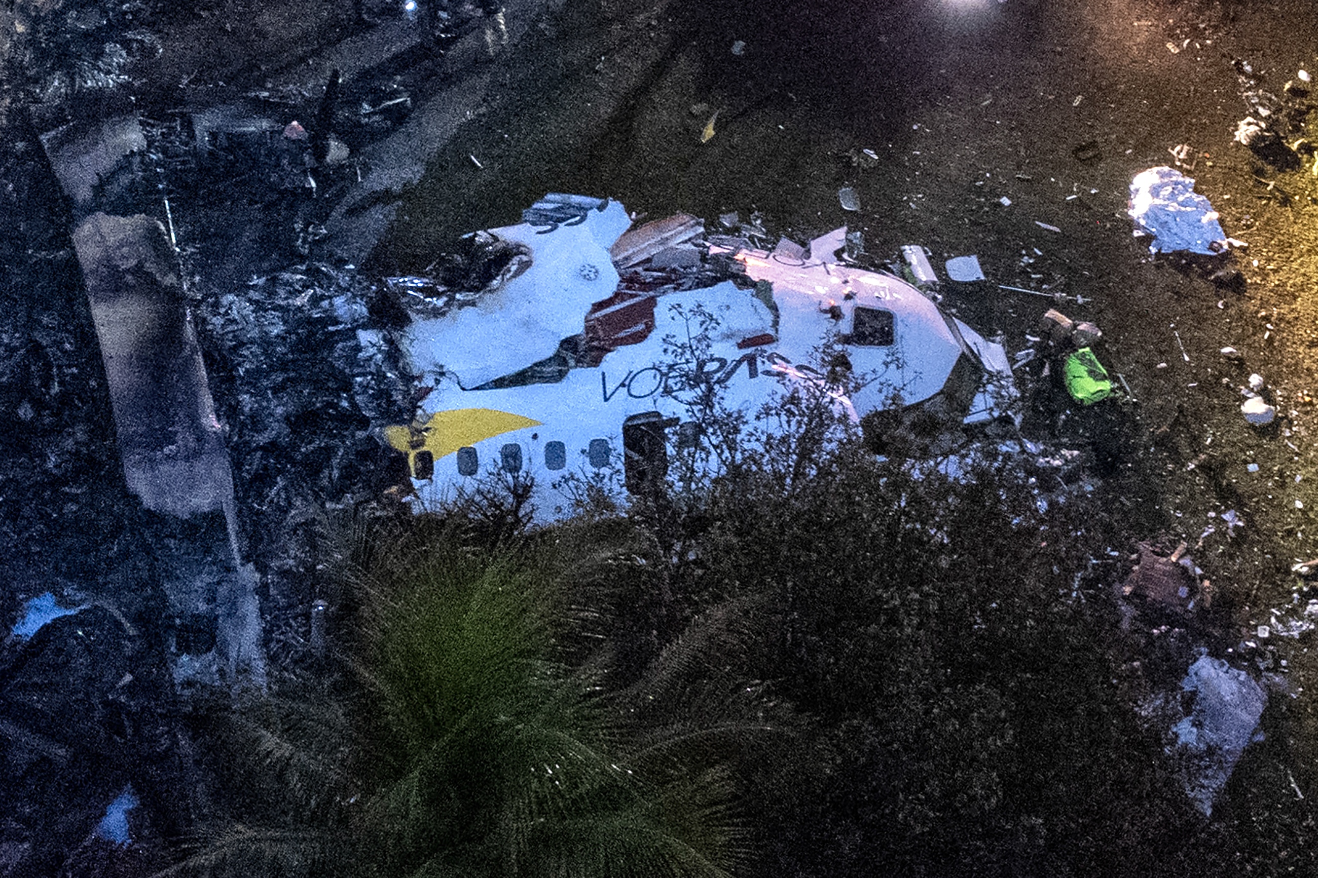 Aerial view of the remains of a plane that crashed with 61 people on board in Brazil.